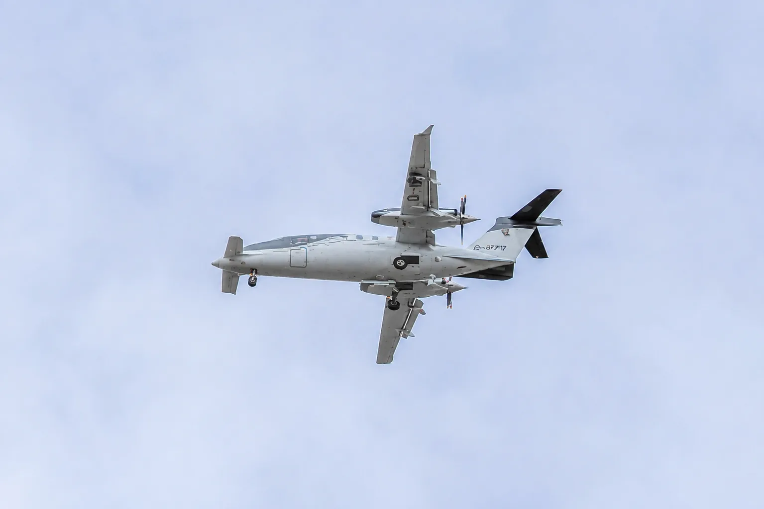 A military Piaggio P.180 Avanti twin-turboprop on approach to Farnborough