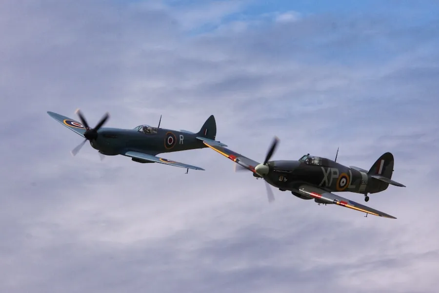 Two Spitfires flying together at an airshow