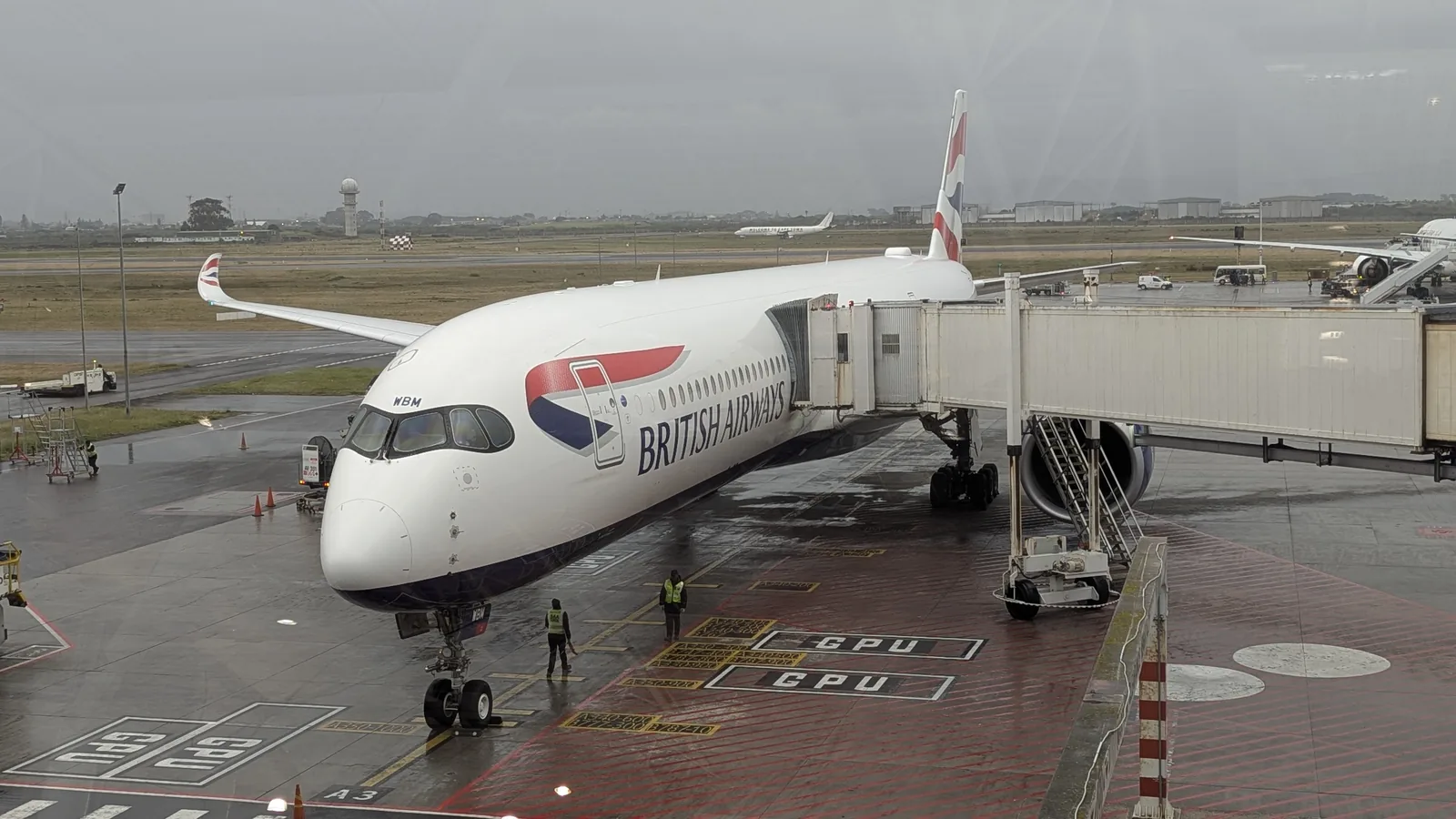British Airways Airbus A350-1000 registration G-XWBM, a Heathrow-based aircraft, parked at the gate