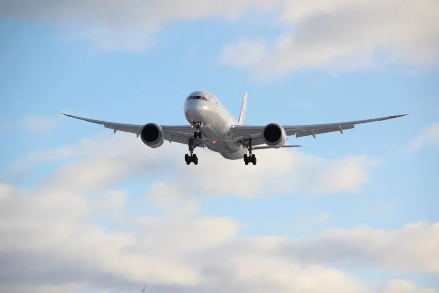 Airliner on final approach in a cloudy sky